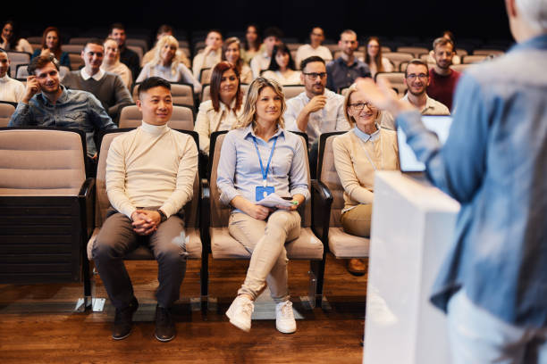 istock Crowd of people attending a seminar in convention center. 2132173272