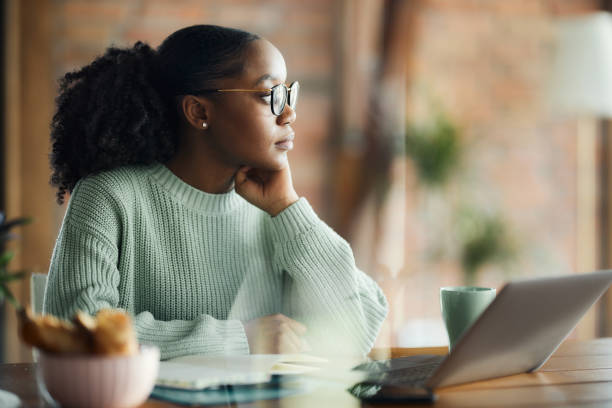 istock Pensive African American graphic designer working on a computer at casual office. 2132196544