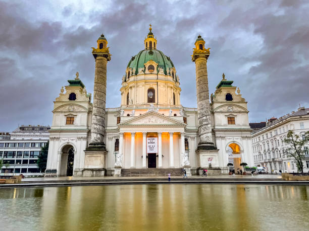 Karlskirche baroque church during an overcast evening in Vienna, Austria.