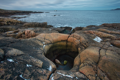 Seascape view of of rocky shore along Pacific Grove.\n\nTaken along Pacific Grove, California, USA.