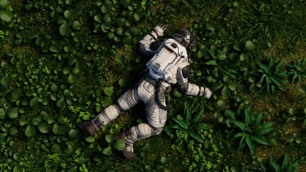 istock Astronaut in full gear rests among lush plants, suggesting a peaceful break during exploration. Dead cosmonaut. 3d render 2132267732