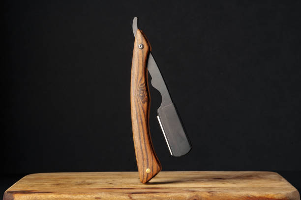 istock Handcrafted Wooden Folding Knife Displayed on a Rustic Table Against a Dark Background 2132287517