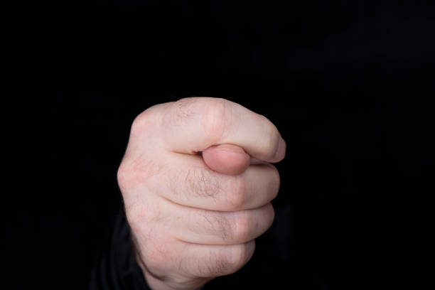 istock A man's hand with a gesture of negative decision, disapproval, as well as a gesture that drives away evil spirits. 2132305047