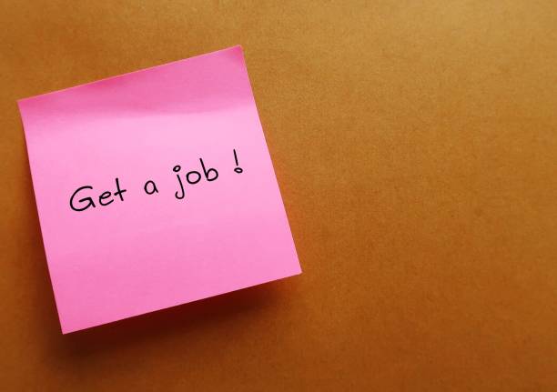 istock ink note stick on office envelope with text written GET A JOB ! - concept of first jobber seeking job to begin career, full time employee changing positions or transferring to a new industry 2132309236
