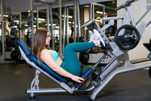 istock A woman is exercising on a leg press machine 2132357061