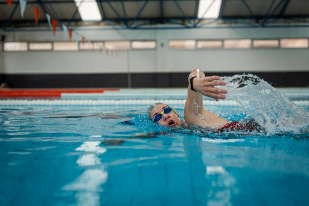 istock Female Athlete swim freestyle at pool 2132362219