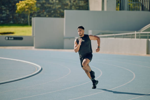 istock Athlete, running and man at stadium for exercise, workout and cardio training for a competition, marathon or sports race. Male outdoor for run, speed and track performance for goal and wellness 2132367446