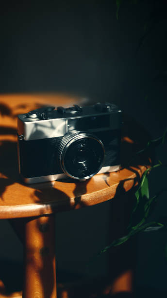 istock Vintage analog 35mm film camera in moody light 2132389678