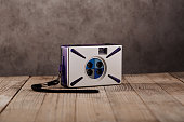 Vintage analog point and shoot film camera with four lenses