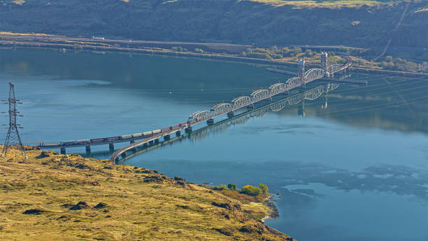 Aerial view of  Oregon Trunk Rail Bridge spanning over Columbia river between Oregon and Washington State, USA.