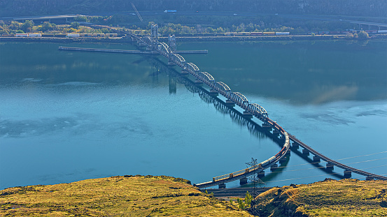 Aerial view of  Oregon Trunk Rail Bridge spanning over Columbia river between Oregon and Washington State, USA.