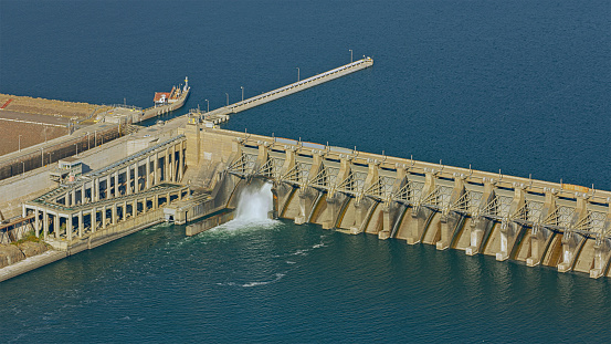 Aerial photo of Bradbury Dam, which forms Lake Cachuma. Photo shows the dam and includes the spillway in November 2023 when water levels in California are high.