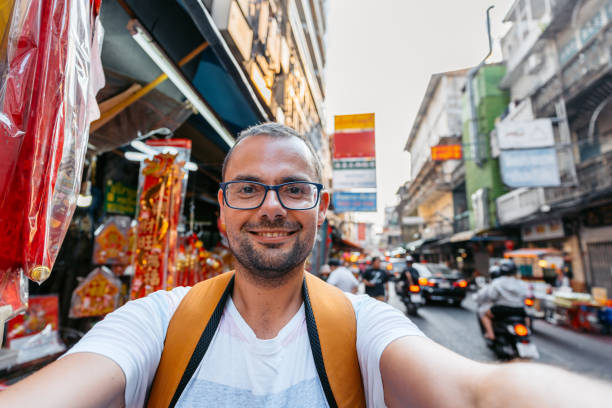 istock Young Man Taking Selfies In Chinatown In Bangkok 2132440625