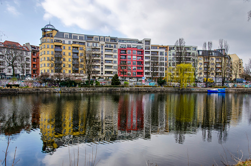 Berlin, Germany, March 6, 2024: apartment buildings in Charlottenburg neighbourhood reflecting in the river Spree