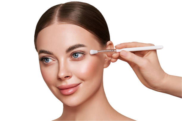 istock Makeup artist applies eye shadow 2132514174