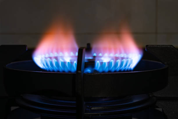 istock gas burning from a kitchen gas stove in dark 2132526207