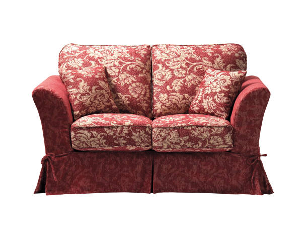 istock Contemporary sofa and pillow with floral pattern isolated on white background 2132601356