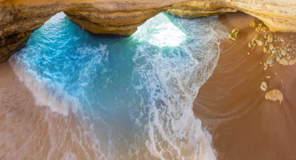 Benagil cave Lagoa near Carvoeiro in Portugal Algarve aerial Benagil cave Lagoa near Carvoeiro in Portugal Algarve aerial view beautiful beach in carvoeiro algarve portugal stock pictures, royalty-free photos & images