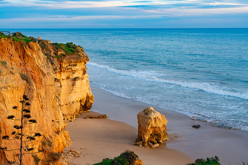 Portimao sunset in Praia dos Tres Castelos beach in Algarve of Portugal