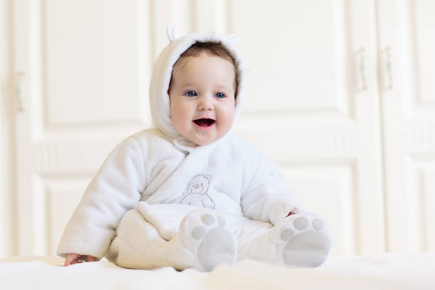 istock Little baby on white bed 2132648053