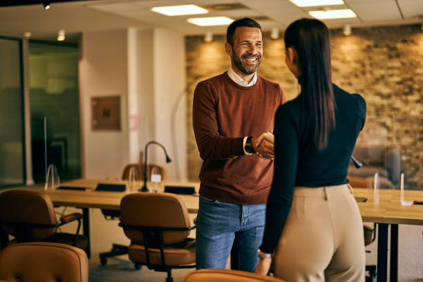 istock Smiling business partners finished meeting and shaking hands. 2132668367