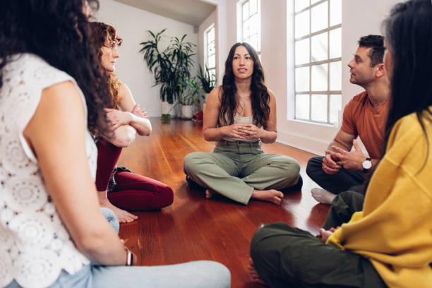 istock Group therapy, people meditation in circle on a group session 2132714869