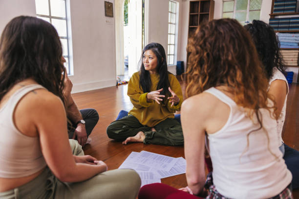 istock Group therapy, people meditation in circle on a group session 2132719996