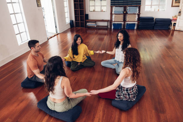 istock Group therapy, people meditation in circle on a group session 2132727242