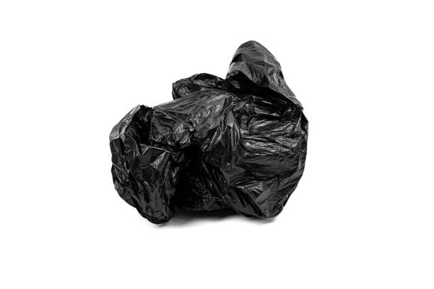 istock Crumpled black plastic garbage bag isolated on white background. 2132738118