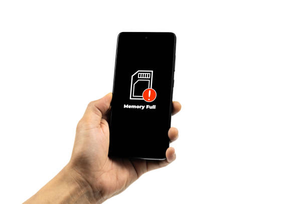 istock Cellular Problems Concepts. Man hand holding smart phone with full storage icon on screen isolated on white background. All screen graphics are made up. 2132741280