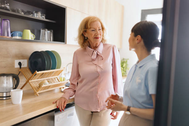 istock Caregiver having a conversation with the patient in the kitchen 2132756307