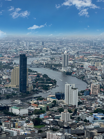 Stock photo showing elevated view of skyscrapers in Sukhumvit downtown, city centre Bangkok, Thailand seen from observation point.