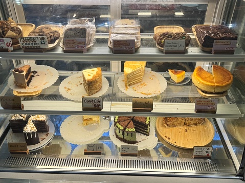 Cakes, cookies, brownies in a display case