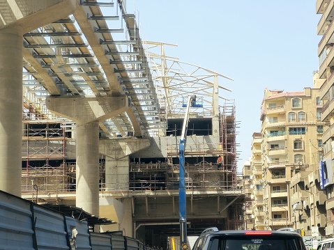 Cairo, Egypt, March 31 2024: A monorail station site that is under construction with scaffolds and crane, Cairo monorail is a two-line mono rail rapid transit system currently under construction, selective focus