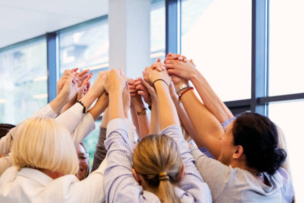 istock Business colleagues holding hands of each other during group therapy 2132797193