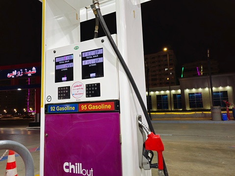 Cairo, Egypt, March 31 2024: Chillout gas service station with filling gun pistols, digital unit price and liters meter device, filling nozzles set device, fuel and petroleum price concept, Chill Out, selective focus