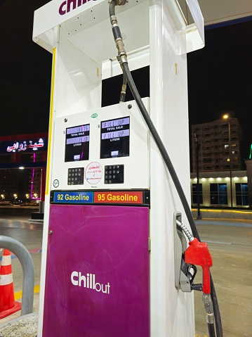 Cairo, Egypt, March 31 2024: Chillout gas service station with filling gun pistols, digital unit price and liters meter device, filling nozzles set device, fuel and petroleum price concept, Chill Out, selective focus