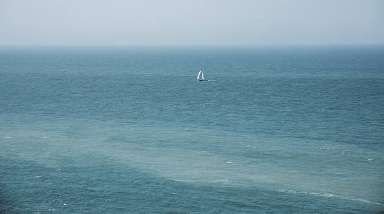 Small pleasure boat sailing off the Breton coast