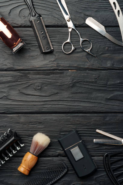 istock Professional Barber Tools Laid Out on Dark Wooden Surface 2132862249