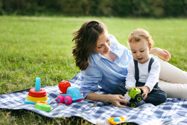 istock Mom and son in a park 2132889272