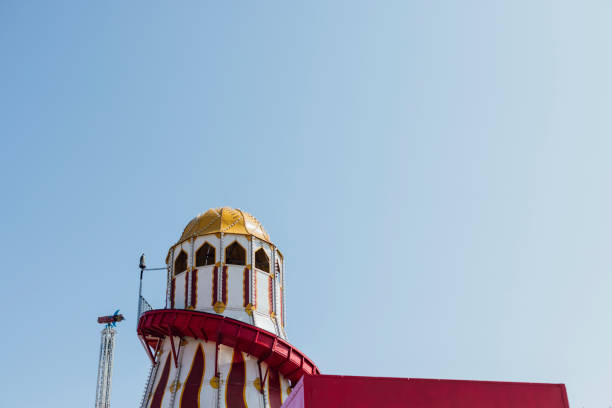 Low angle view with copy space of a helter skelter at a travelling fairground in the North East of England.