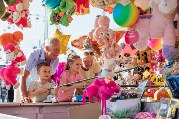 istock Grandparents and Children Playing Hook a Duck 2132938877