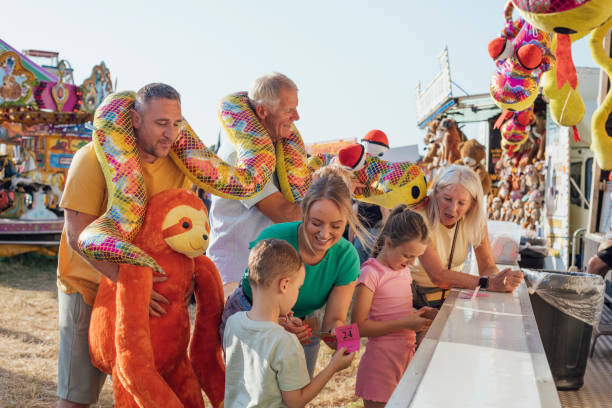 istock Trying their Luck at the Funfair 2132939912