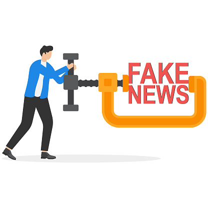 Stop fake news and misinformation spreading on the internet and media concept, businessman leaders squeezing and destroying the word fake news.