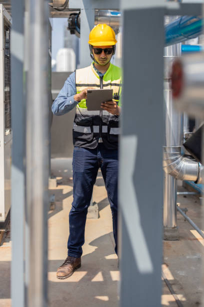 istock HVAC technician analyzes mechanical, electrical, plumbing systems with energy efficiency plan 2133000183