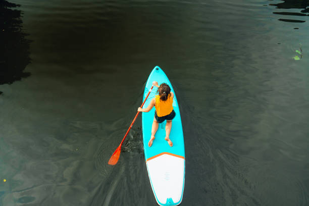 istock Woman SUP boarding on canal in the Netherlands 2133017940