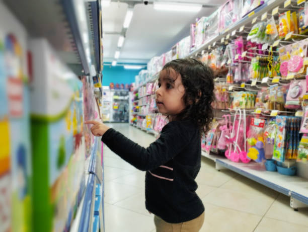 istock Child choosing toys. 2133029959