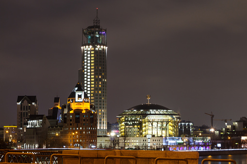 Night view from Novospassky bridge to the Philharmonic, business center and hotel. Moscow, Russia, March 17, 2019.