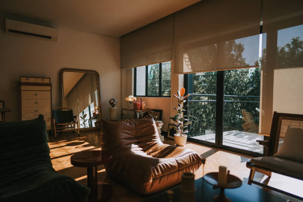 istock Living room in morning illuminated by sunlight through window 2133069034