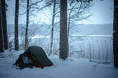 Winter holidays in the snow. Tent in the woods